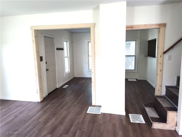 681 Madison St, Conneaut, OH 44030 - foyer entrance featuring stairway, wood finished floors, healthy amount of natural light, and baseboards