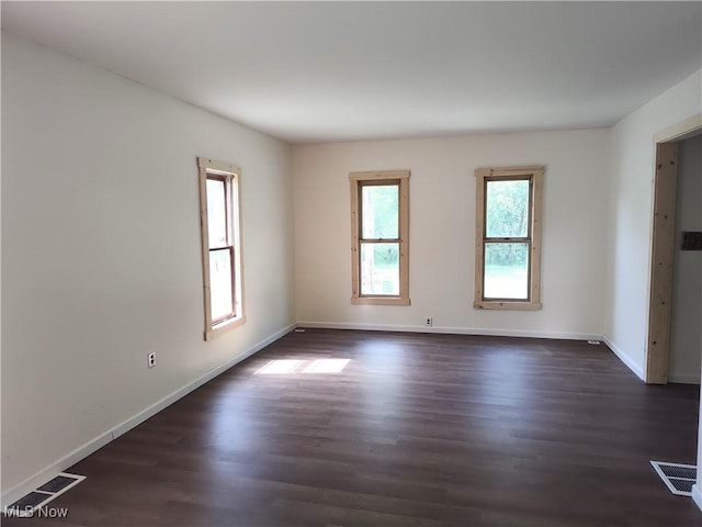 681 Madison St, Conneaut, OH 44030 - unfurnished room with dark wood-type flooring and baseboards