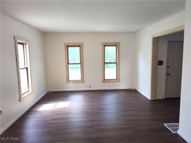 681 Madison St, Conneaut, OH 44030 - spare room with baseboards and dark wood finished floors