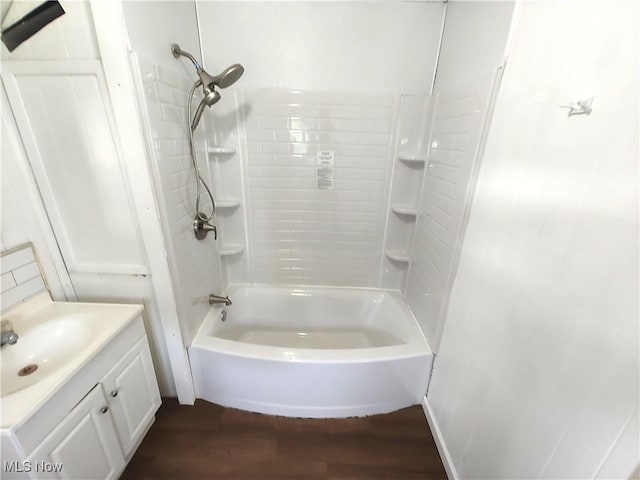 681 Madison St, Conneaut, OH 44030 - full bathroom with vanity, tub / shower combination, and wood finished floors
