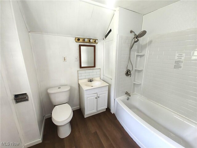 681 Madison St, Conneaut, OH 44030 - full bathroom featuring vanity, toilet, wood finished floors, and bathtub / shower combination