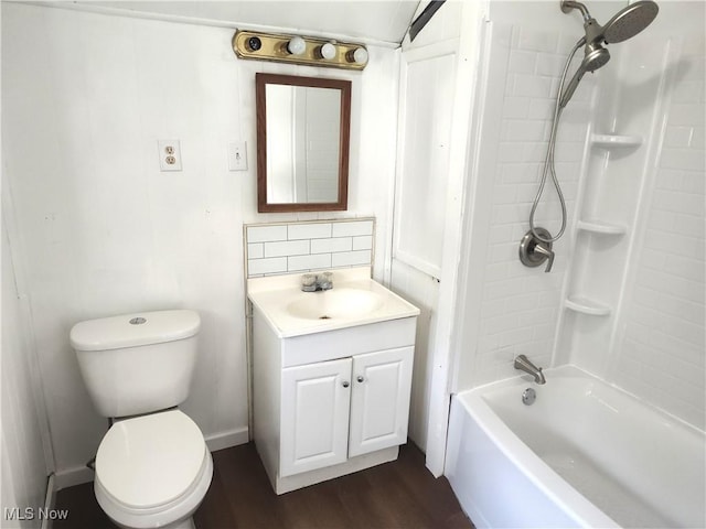 681 Madison St, Conneaut, OH 44030 - bathroom with vanity, toilet,  shower combination, decorative backsplash, and wood finished floors