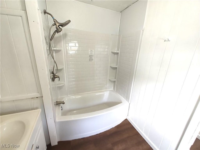 681 Madison St, Conneaut, OH 44030 - full bath with wood finished floors, tub / shower combination, and vanity