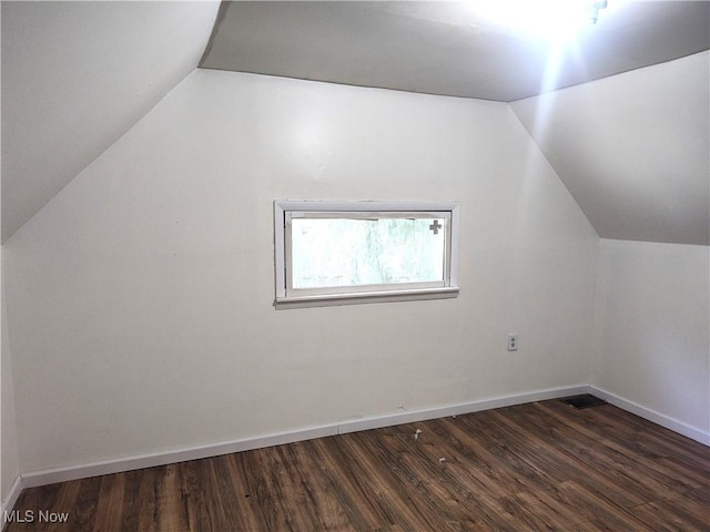 681 Madison St, Conneaut, OH 44030 - bonus room featuring lofted ceiling, dark wood-style floors, and baseboards