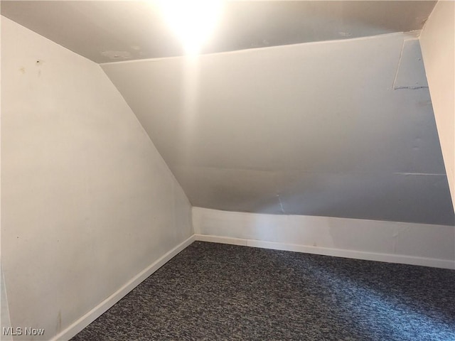 681 Madison St, Conneaut, OH 44030 - additional living space featuring lofted ceiling, carpet flooring, and baseboards