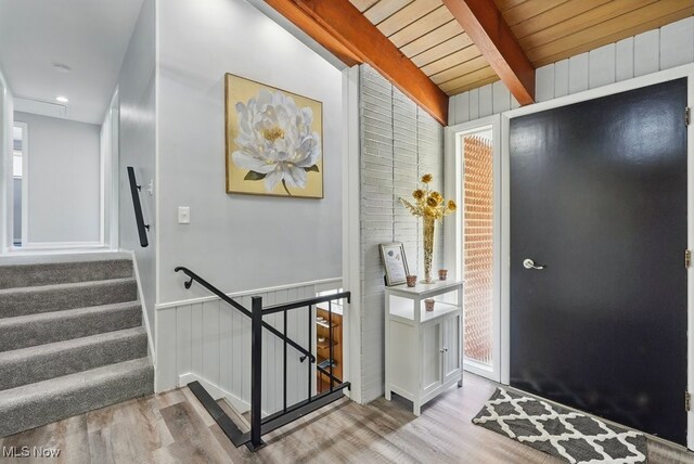 8049 Mccreary Rd, Broadview Heights, OH 44147 - foyer entrance featuring wood finished floors, a wood ceiling with exposed beams, and wooden walls