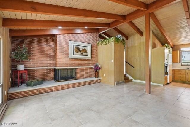 8049 Mccreary Rd, Broadview Heights, OH 44147 - unfurnished living room with stairs, wood ceiling, wood walls, and brick wall