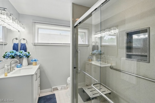 8049 Mccreary Rd, Broadview Heights, OH 44147 - bathroom featuring vanity, a stall shower, plenty of natural light, and toilet