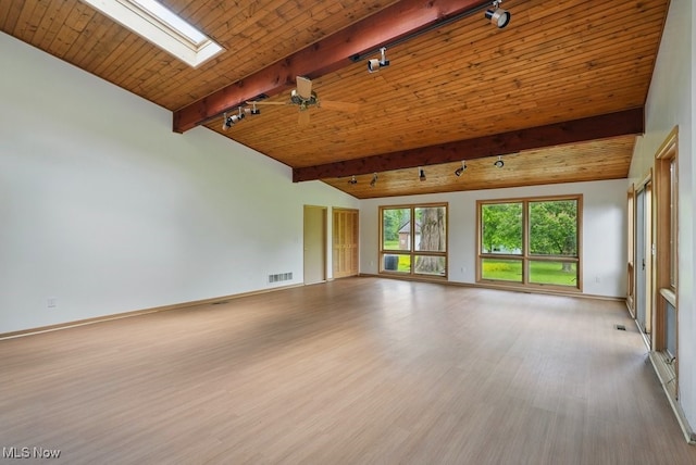 8049 Mccreary Rd, Broadview Heights, OH 44147 - unfurnished living room featuring wood finished floors, a skylight, baseboards, wooden ceiling, and rail lighting