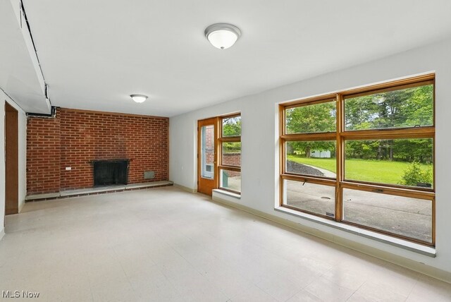 8049 Mccreary Rd, Broadview Heights, OH 44147 - unfurnished living room featuring a fireplace and tile patterned floors