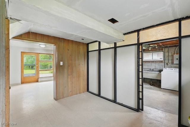 8049 Mccreary Rd, Broadview Heights, OH 44147 - spare room featuring washer / clothes dryer, wooden walls, tile patterned floors, and electric panel