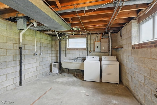 8049 Mccreary Rd, Broadview Heights, OH 44147 - basement with separate washer and dryer, a sink, electric panel, concrete block wall, and healthy amount of natural light