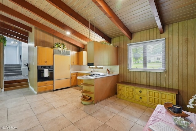 8049 Mccreary Rd, Broadview Heights, OH 44147 - kitchen with oven, paneled fridge, wood walls, a sink, and open shelves