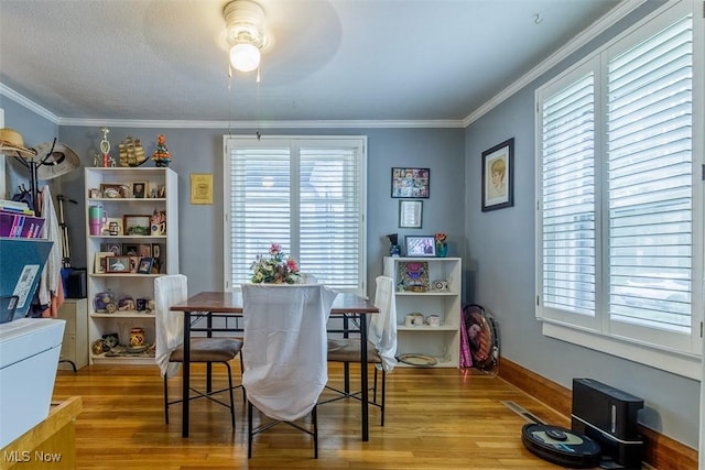 168 Brooklyn Ave, Salem, OH 44460 - dining space featuring wood finished floors, crown molding, baseboards, and a ceiling fan
