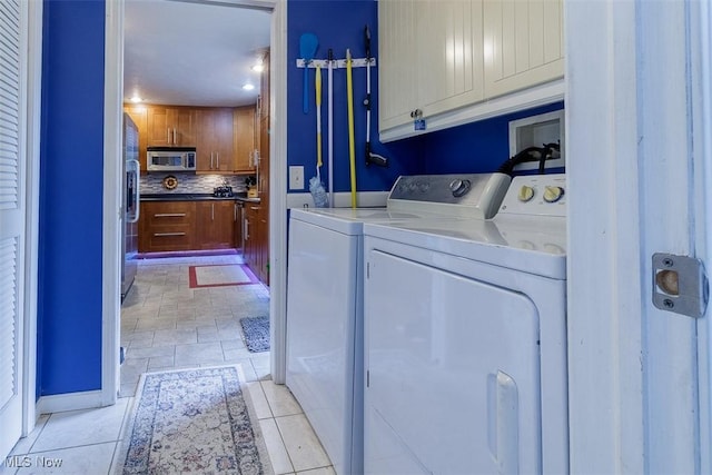 168 Brooklyn Ave, Salem, OH 44460 - laundry area with cabinet space, washing machine and clothes dryer, baseboards, and recessed lighting