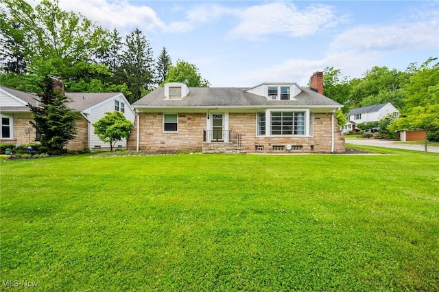 1572 S Belvoir Blvd, South Euclid, OH 44121 - view of front facade featuring a front yard, a chimney, and stone siding