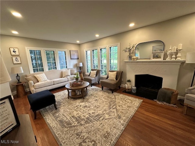 13707 Drexmore Rd, Shaker Heights, OH 44120 - living room with wood finished floors, a fireplace with flush hearth, and recessed lighting