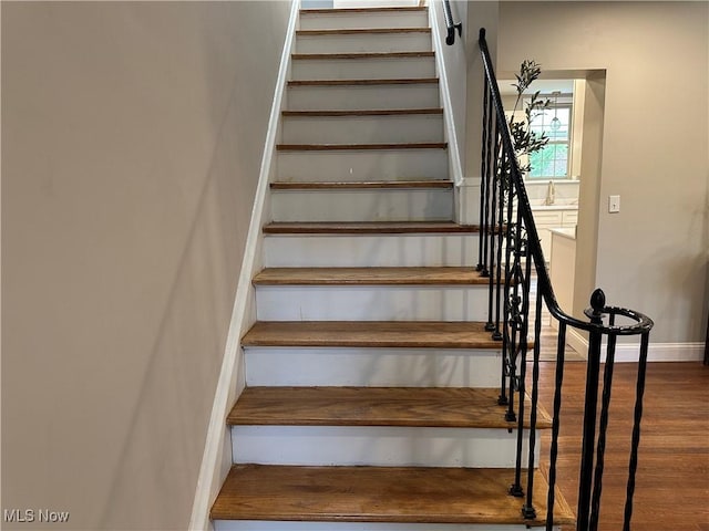 13707 Drexmore Rd, Shaker Heights, OH 44120 - staircase with wood finished floors and baseboards