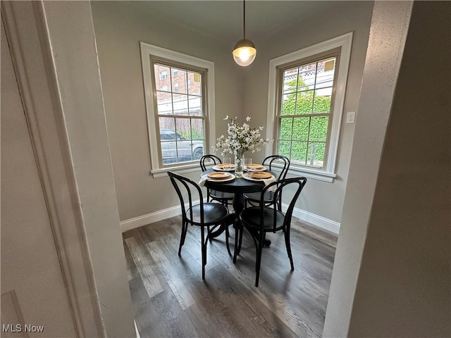 13707 Drexmore Rd, Shaker Heights, OH 44120 - dining area with dark wood-type flooring and baseboards