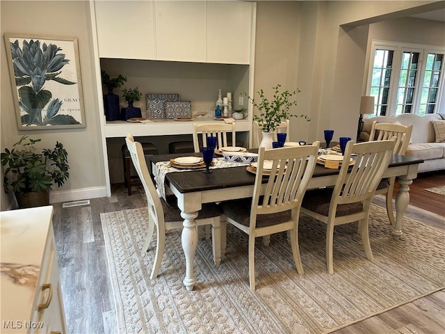 13707 Drexmore Rd, Shaker Heights, OH 44120 - dining area featuring wood finished floors and baseboards