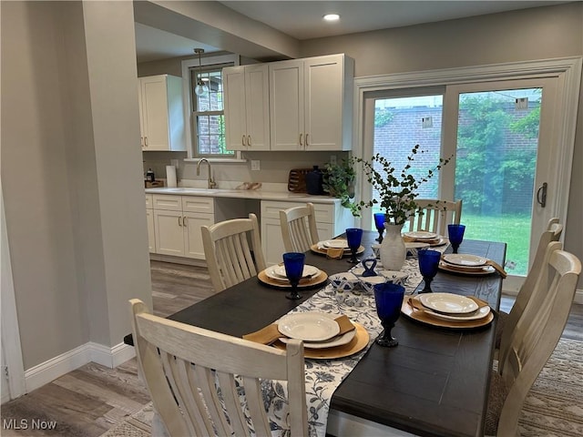 13707 Drexmore Rd, Shaker Heights, OH 44120 - dining area with light wood-type flooring, baseboards, and recessed lighting