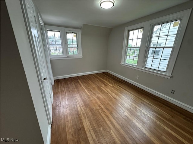 13707 Drexmore Rd, Shaker Heights, OH 44120 - spare room with plenty of natural light, wood-type flooring, and baseboards
