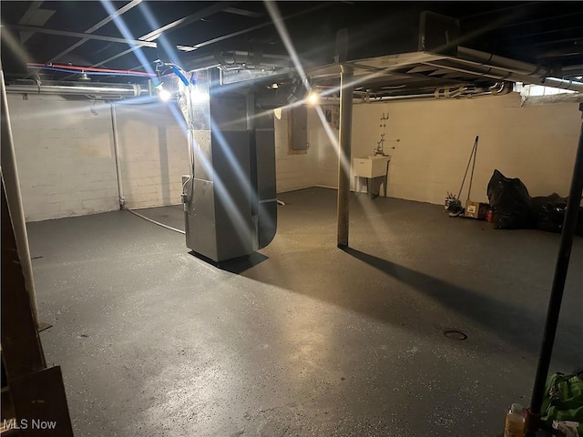 13707 Drexmore Rd, Shaker Heights, OH 44120 - unfinished basement with electric panel, heating unit, and a sink