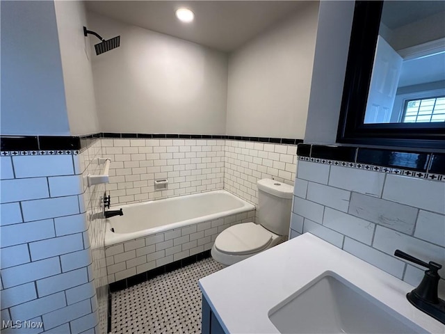 13707 Drexmore Rd, Shaker Heights, OH 44120 - full bathroom featuring tile walls, toilet, a garden tub, wainscoting, and recessed lighting