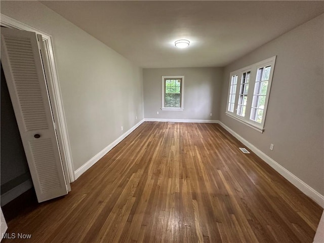 13707 Drexmore Rd, Shaker Heights, OH 44120 - empty room with dark wood-type flooring and baseboards