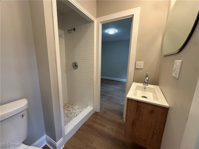 13707 Drexmore Rd, Shaker Heights, OH 44120 - bathroom featuring a shower stall, wood finished floors, vanity, toilet, and baseboards