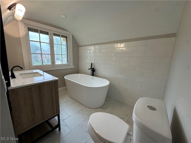 13707 Drexmore Rd, Shaker Heights, OH 44120 - bathroom featuring marble finish floors, a freestanding bath, tile walls, toilet, and vanity