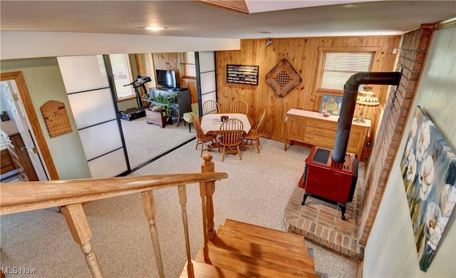 85530 Beagle Club Rd, Scio, OH 43988 - interior space featuring carpet, a wood stove, and wooden walls