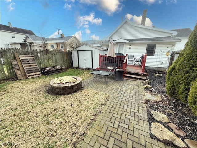 1324 N 4th St, Toronto, OH 43964 - rear view of property featuring a fire pit, a wooden deck, and a patio