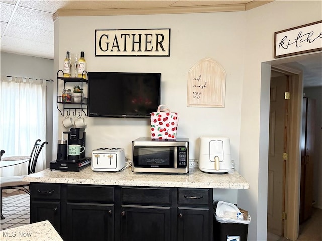1324 N 4th St, Toronto, OH 43964 - bar featuring stainless steel microwave, a paneled ceiling, and crown molding