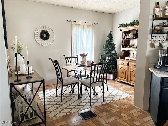 1324 N 4th St, Toronto, OH 43964 - dining space featuring brick patterned floors and a paneled ceiling