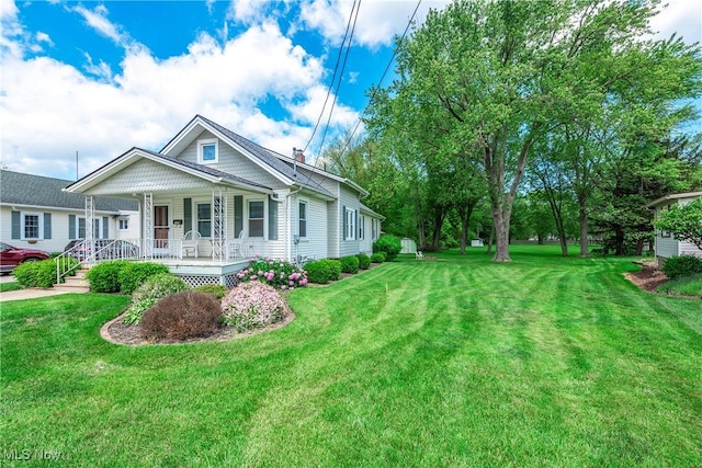 163 E Martin St, Amherst, OH 44001 - view of front of house with covered porch and a front yard