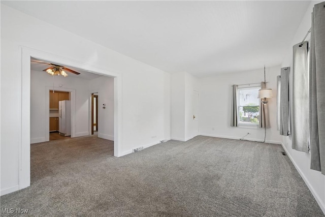 163 E Martin St, Amherst, OH 44001 - carpeted spare room featuring a ceiling fan and baseboards