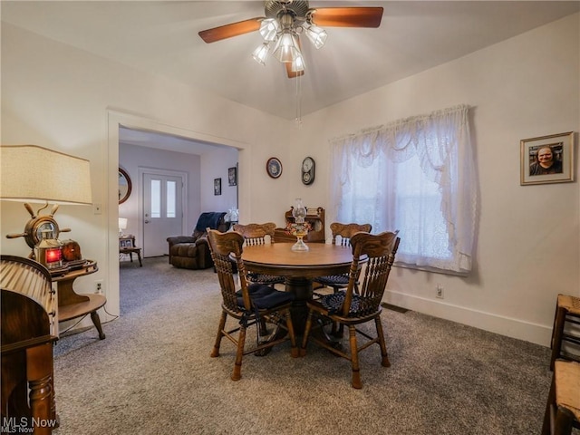 163 E Martin St, Amherst, OH 44001 - carpeted dining area with ceiling fan and baseboards