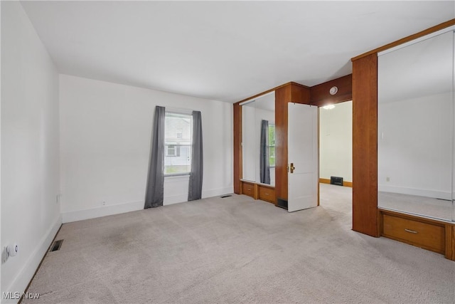 163 E Martin St, Amherst, OH 44001 - empty room featuring light colored carpet and baseboards