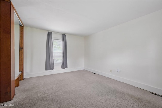 163 E Martin St, Amherst, OH 44001 - spare room with carpet flooring and baseboards