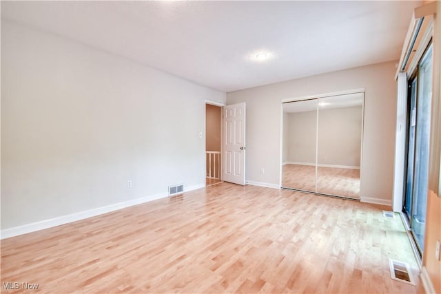 4473 Habersham Ln S, Richmond Heights, OH 44143 - unfurnished bedroom with light wood-style floors, a closet, and baseboards