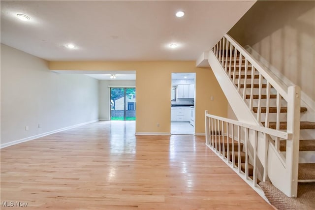 4473 Habersham Ln S, Richmond Heights, OH 44143 - unfurnished living room featuring light wood-type flooring, stairway, baseboards, and recessed lighting