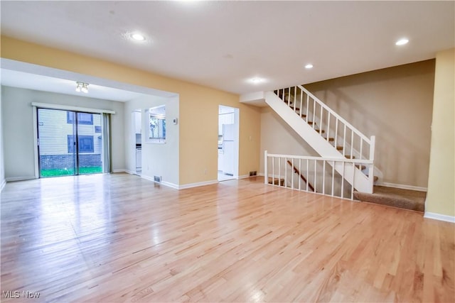 4473 Habersham Ln S, Richmond Heights, OH 44143 - unfurnished living room featuring wood finished floors, baseboards, recessed lighting, and stairs