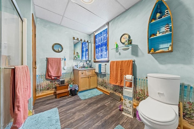 5869 Beechwood Ave, Alliance, OH 44601 - full bath with a drop ceiling, wood finished floors, toilet, vanity, and a stall shower