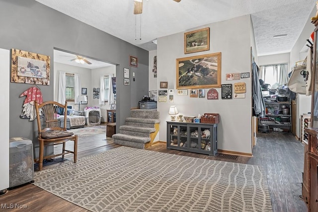 5869 Beechwood Ave, Alliance, OH 44601 - hall with wood finished floors, a textured ceiling, baseboards, and stairs
