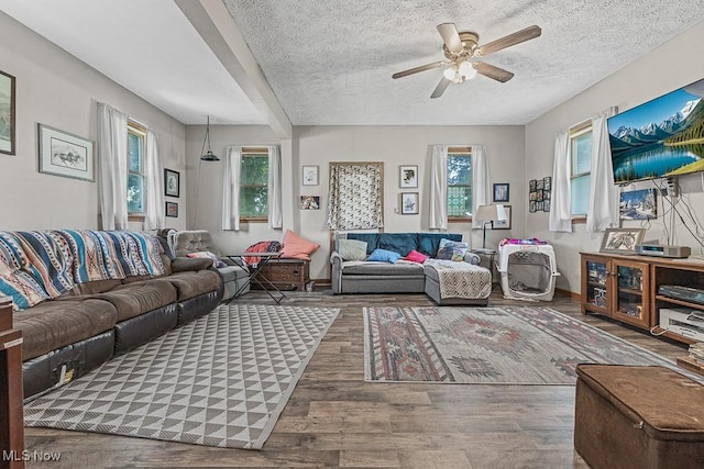 5869 Beechwood Ave, Alliance, OH 44601 - living room with ceiling fan, wood finished floors, a textured ceiling, and baseboards