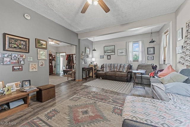 5869 Beechwood Ave, Alliance, OH 44601 - living area featuring a ceiling fan, wood finished floors, and a textured ceiling