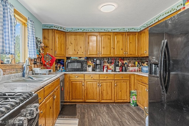 5869 Beechwood Ave, Alliance, OH 44601 - kitchen featuring black appliances, dark wood-type flooring, brown cabinetry, and light countertops