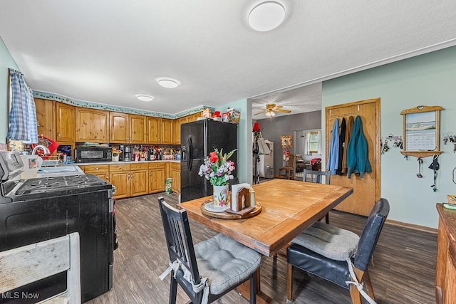 5869 Beechwood Ave, Alliance, OH 44601 - kitchen featuring black appliances, dark wood finished floors, brown cabinetry, a sink, and a ceiling fan