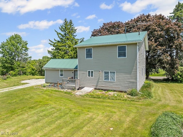 5869 Beechwood Ave, Alliance, OH 44601 - rear view of property featuring a yard and metal roof
